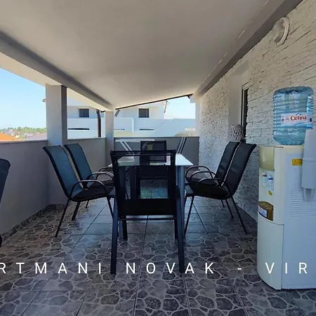 Novak - *